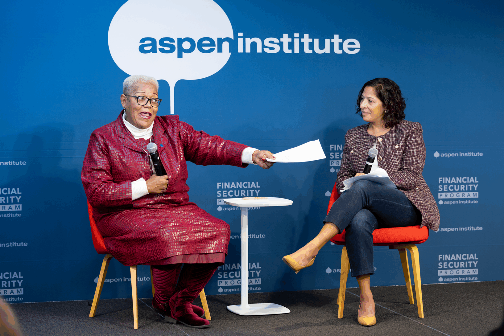 A speaker points to the audience at a panel