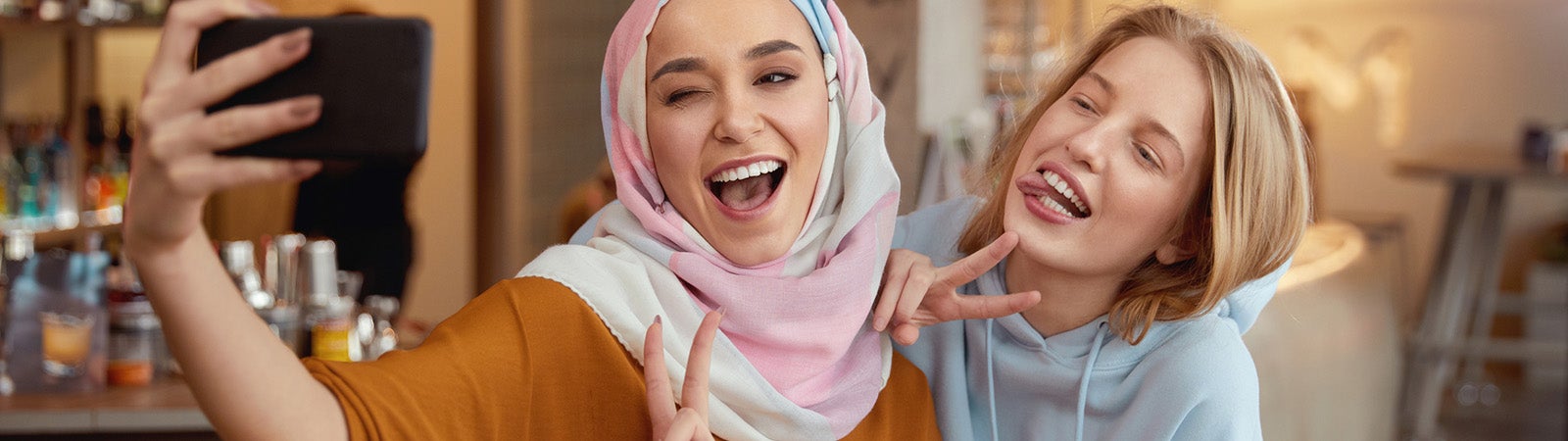 Muslim and Christian girls take a selfie