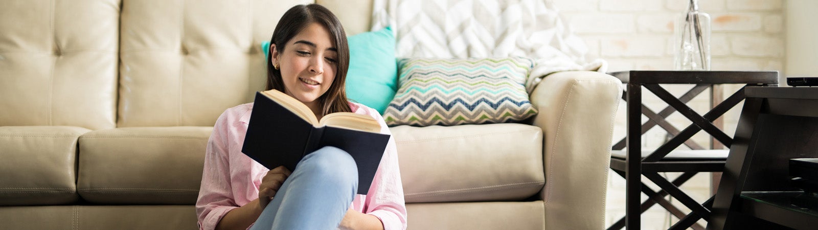 Latina girl reading a book