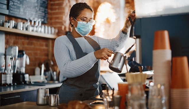 Restaurant worker making drinks