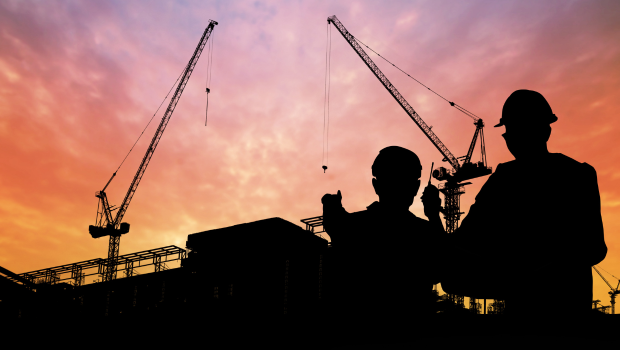 Decorative banner featuring the logo of UpSkill America at the Aspen Institute. The background includes a stylized silhouette of two construction workers wearing hard hats and looking at a construction site.